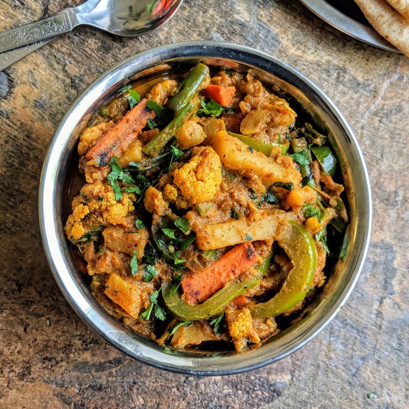Annapoorani's Indian mixed vegetable curry with cauliflower, carrots, potatoes, and bell peppers.
